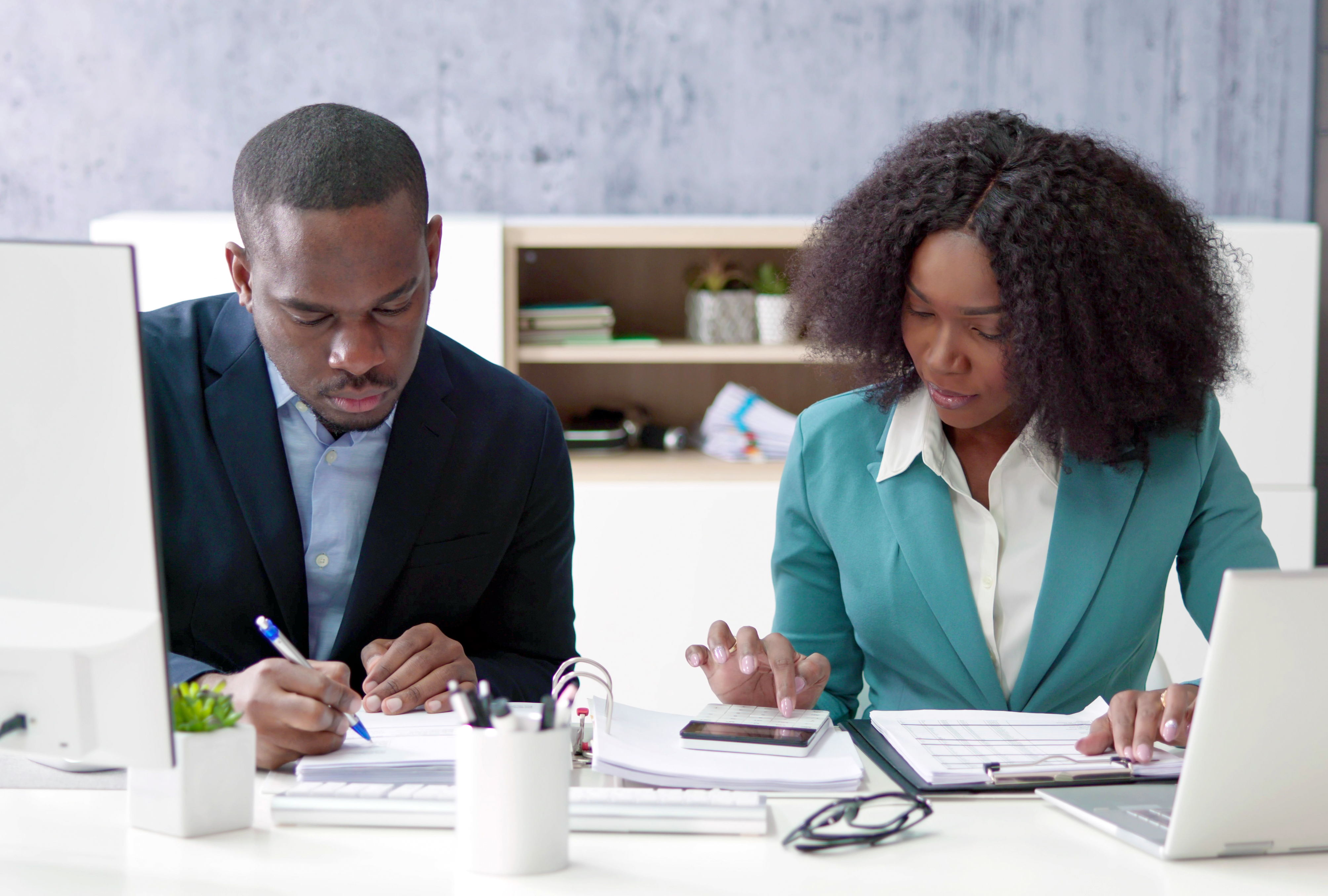 two colleagues discussing IT operating standards